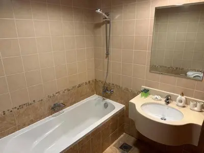 a bathroom with a tub and a sink at Khayali Marina Holiday Homes Dubai Marina JBR in Dubai