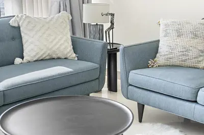 a living room with two chairs and a coffee table at VayK - Spacious 2BR in JLT with Marina Views in Dubai