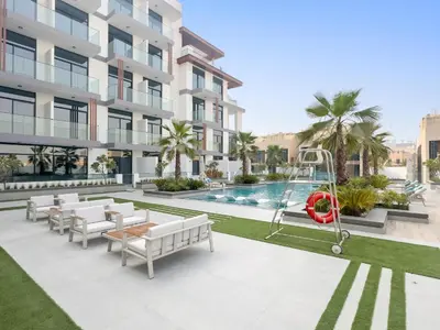 an image of a building with a swimming pool at VayK - Modern Studio with Great Amenities in Dubai