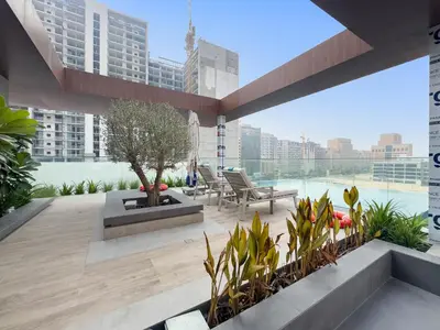 a rendering of a rooftop patio with a view of the city at VayK - Modern Studio with Great Amenities in Dubai