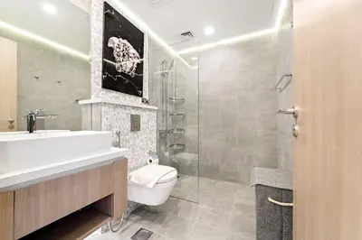 a bathroom with a sink and a toilet and a shower at VayK - Ultra-Luxury 3BR Marina Retreat with Stunning View in Dubai