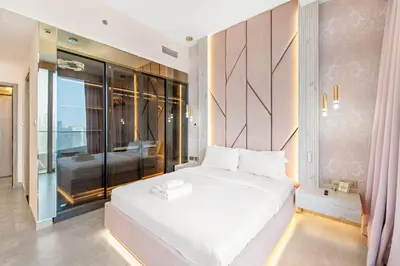 a bedroom with a large white bed in a room at VayK - Ultra-Luxury 3BR Marina Retreat with Stunning View in Dubai