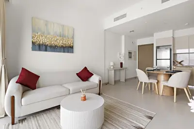 a living room with a couch and a table at VayK - Stylish 1BR in Prime Downtown Location in Dubai