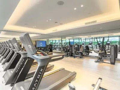 a gym with treadmills and machines in a building at VayK - Exceptional 3BR at Address Dubai Opera in Dubai