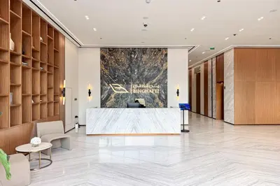 a lobby with a reception desk in a building at PVH - Serene 1BR with City View - Binghatti House in Dubai