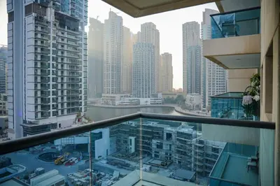 a view of a city from a balcony of a building at 1 Bedroom Apartment at Marina with Stunning View in Dubai