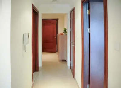 an empty hallway with two doors at 1 Bedroom Apartment at Marina with Stunning View in Dubai