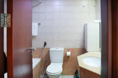 a bathroom with a toilet and a sink at 1 Bedroom Apartment at Marina with Stunning View in Dubai