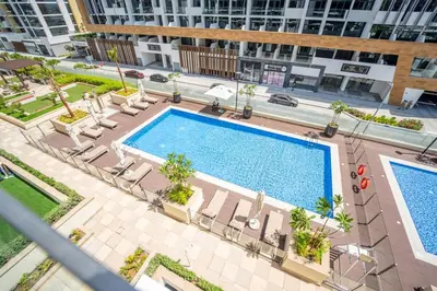 an overhead view of a swimming pool in a building at AWS Holiday Homes - Comfy Cozy Studio in Dubai