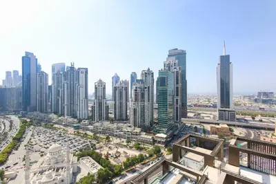 an aerial view of a city with tall buildings at Bright 2BR with Burj, Sea & City Views - Walk to Mall in Dubai