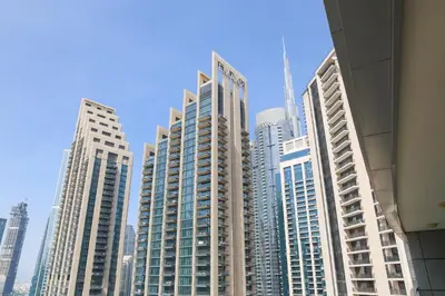 a group of tall buildings in a city at Bright 2BR with Burj, Sea & City Views - Walk to Mall in Dubai