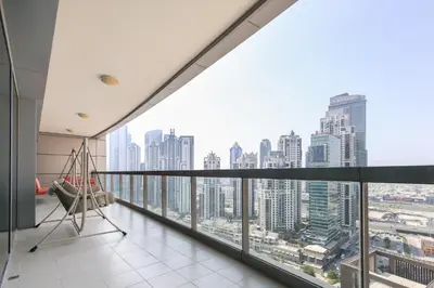 a balcony with a view of a city skyline at Bright 2BR with Burj, Sea & City Views - Walk to Mall in Dubai
