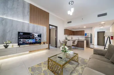 a living room with a couch and a table at Elegant JVC 1-Bed with Upgraded Interiors in Dubai