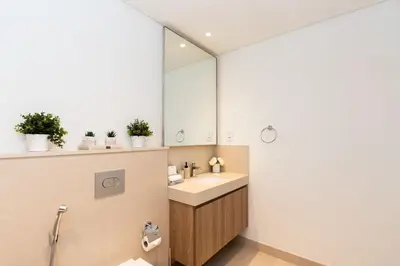 a bathroom with a sink and a mirror at CitiHome Luxury 1BR - Downtown Views 2 High Floor in Dubai