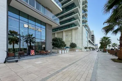 a large building with a street in front of it at Elegant 2 Bed Beach Front Retreat in Dubai