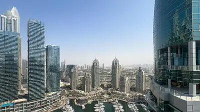 an aerial view of a city with tall buildings at Waterfront 1BR, Full Marina View & Pool Access - 34AB04 in Dubai