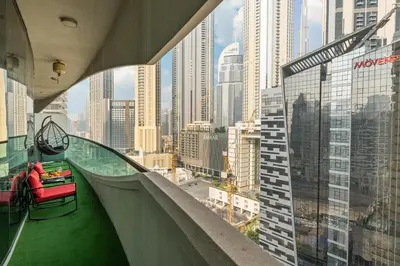 a balcony with a view of a city at Luxe 2 Bedroom Near Dubai Mall DAMAC Uppercrest Downtown - Free Parking in Dubai