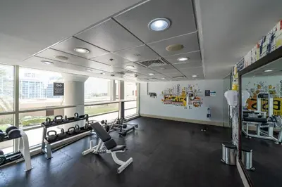a gym with treadmills and cardio equipment in a building at Exquisite 2BR Apartment in Dubai Marina in Dubai