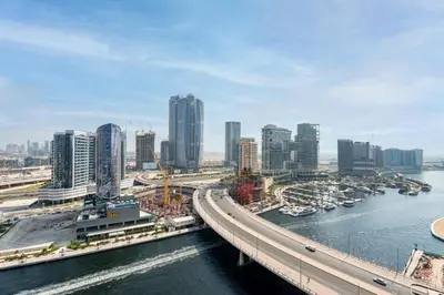 an aerial view of a city with a river and buildings at GuestReady - Canal View Studio | Near Dubai Mall in Dubai