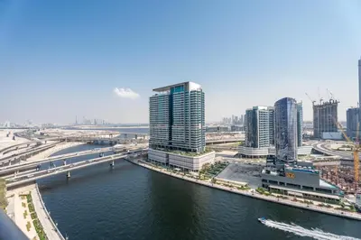 a view of a city with tall buildings and a river at GuestReady - Canal View Studio | Near Dubai Mall in Dubai
