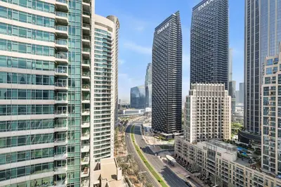 a view of a city with tall buildings at Stunning 2BR in Downtown Partial Burj Khalifa View in Dubai
