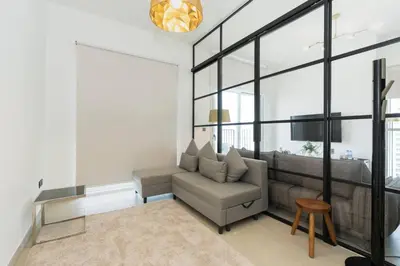 a living room with a couch and a table at CitiHome - Modern Stay - Dubai Hills 2BR in Dubai
