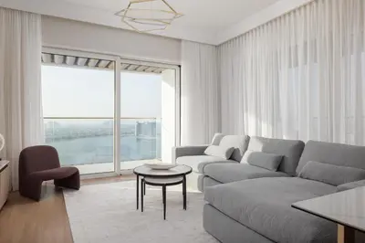 a living room with a couch and a table at Elegant 2BR Apartment with Sea View in Dubai