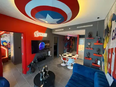a living room with a captain america ceiling at Capsule Super Heroes - Playstation 5 Burj Khalifa View - Near Downtown Dubai in Dubai