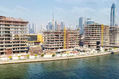 a view of a city next to a body of water at New Luxury Canalfront 2 Bedroom Apartment with Burj Views in Dubai