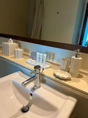 a bathroom sink in front of a bathroom mirror at 1 BR Apartment in Dubai Marina - Paloma Tower - Sea View - 3 Mins away from Tram & Beach in Dubai