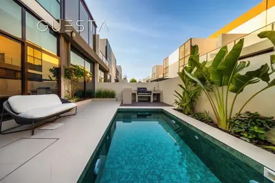 a balcony with a swimming pool in a building at Senses at the Fields - Villa with a Private Pool in Dubai