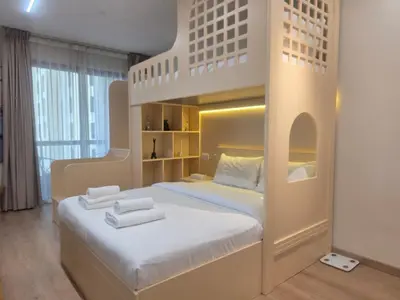a bedroom with a bunk bed with two white pillows at Stylish JBR Studio Beach View EB in Dubai