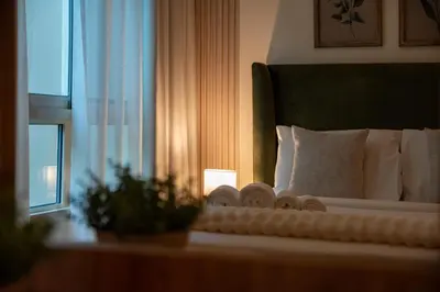 a hotel room with a bed with a window at Surrounded by Nature Near Internet & Media City in Dubai
