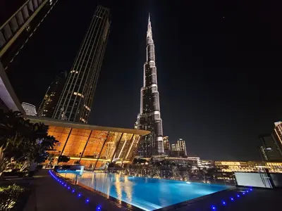 a view of the burj khalifa at night at Vogue Downtown Grande Signature Residences, near Dubai Mall and Burj Khalifa, Two-Bedroom Apartment with Large Balcony, Infinity Pool with Burj Khalifa View, Access to all Amenities in Dubai