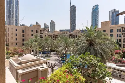 a view of a city with palm trees and buildings at Downtown Zaafaran 2, in Dubai