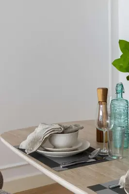 a table with a plate and a bowl on a table at Frank Porter - Bay Square 1 in Dubai