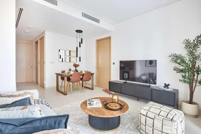 a living room with a couch and a table at Frank Porter - Vida Dubai Mall Tower 2 in Dubai