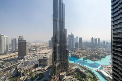 an aerial view of a city with tall buildings at Luxury 2BR at Address Opera with Burj Khalifa view in Dubai