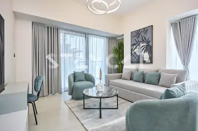 a living room with a couch and a table at Staycae Holiday Homes Golf Gate - Damac Hills in Dubai