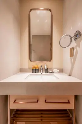 a bathroom with a sink and a mirror at New 2 Br Burj View Vida Dubai Mall Direct Access in Dubai