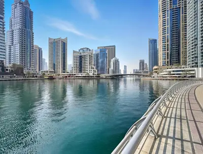 a view of a river in a city with tall buildings at High-Floor 2BR in Dubai Marina with Balcony in Dubai