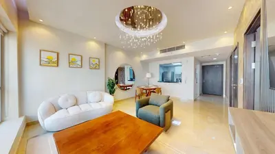 a living room with two chairs and a table at Vacationer l 1 Bedroom Stunning Marina Skyline l Free Pool, Gym Access in Dubai
