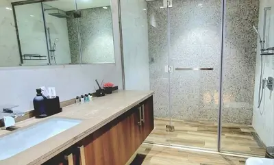 a bathroom with a tub and a glass shower at Stylish Studio in J One, near Burj Khalifa, Mall in Dubai