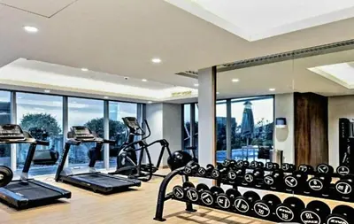 a gym with exercise equipment and a view of the city at Stylish Studio in J One, near Burj Khalifa, Mall in Dubai