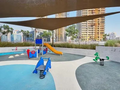 a playground with a slide and a slide at Modern Studio in Business Bay with Pool, Gym & Canal View in Dubai