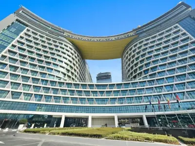 a large building with a lot of windows at Stylish Studio with Rooftop Pool on the Palm in Dubai
