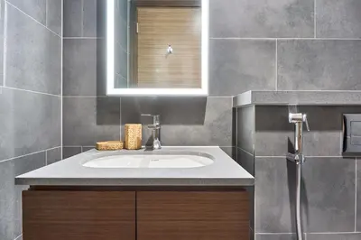 a bathroom with a sink and a mirror at STAY BY LATINEM Luxury 1BR plus study Holiday Home CC 2408 in Dubai