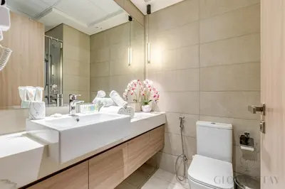 a bathroom with a sink and a toilet at GlobalStay 1 Bedroom Apartment for 4 Guests Azizi Riviera 42 Dubai in Dubai