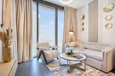 a living room with a couch and a table at STAY BY LATINEM Luxury 1BR Holiday Home CC 3313 Near Burj Khalifa in Dubai