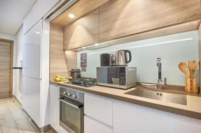 a kitchen with a sink and a microwave at Modern Studio in Studio One Tower, Dubai Marina in Dubai